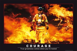 firefighter walking into flames with courage caption